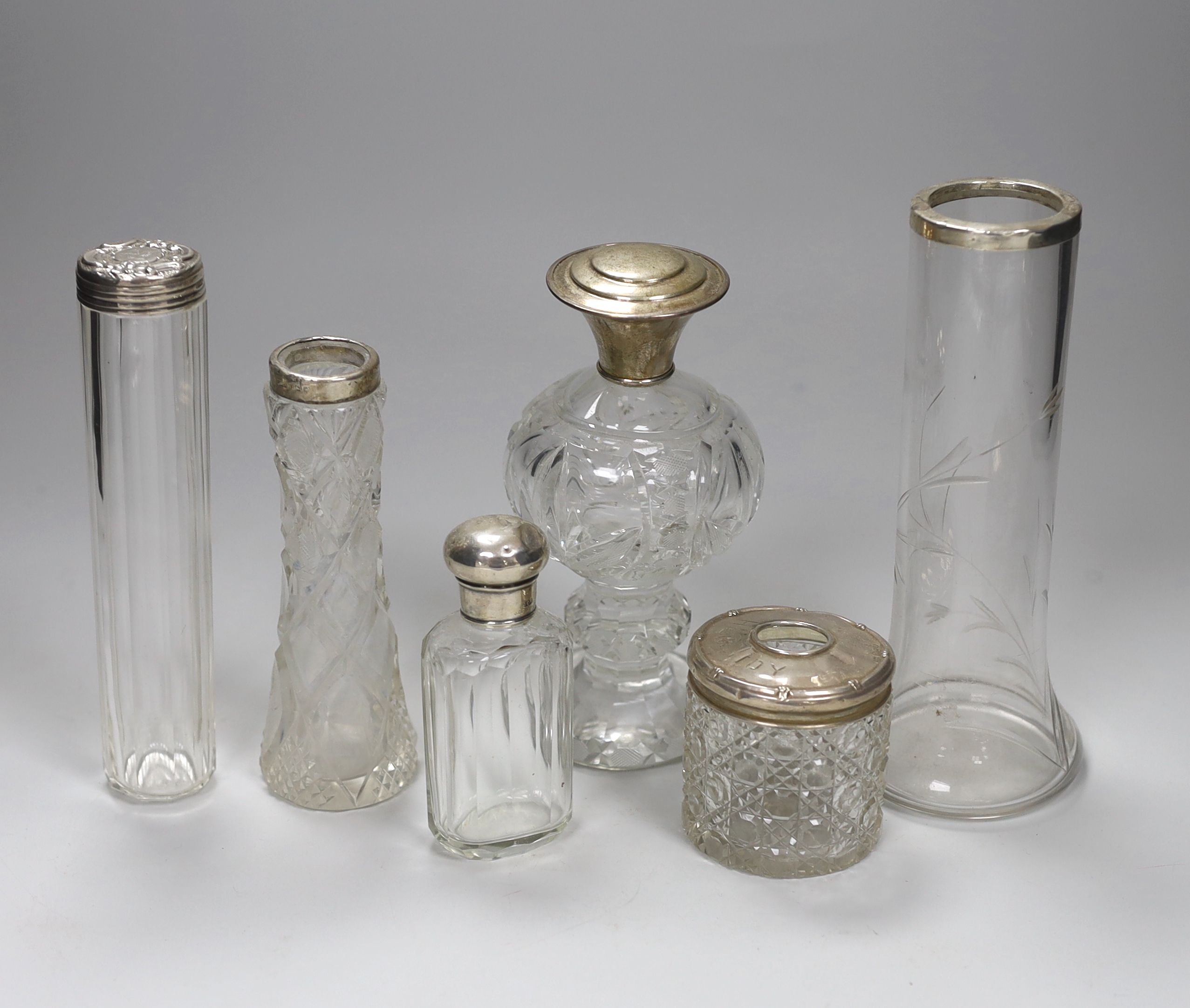 Two silver rimmed cut glass vases, a sterling mounted cut glass scent bottle and three assorted toilet jars